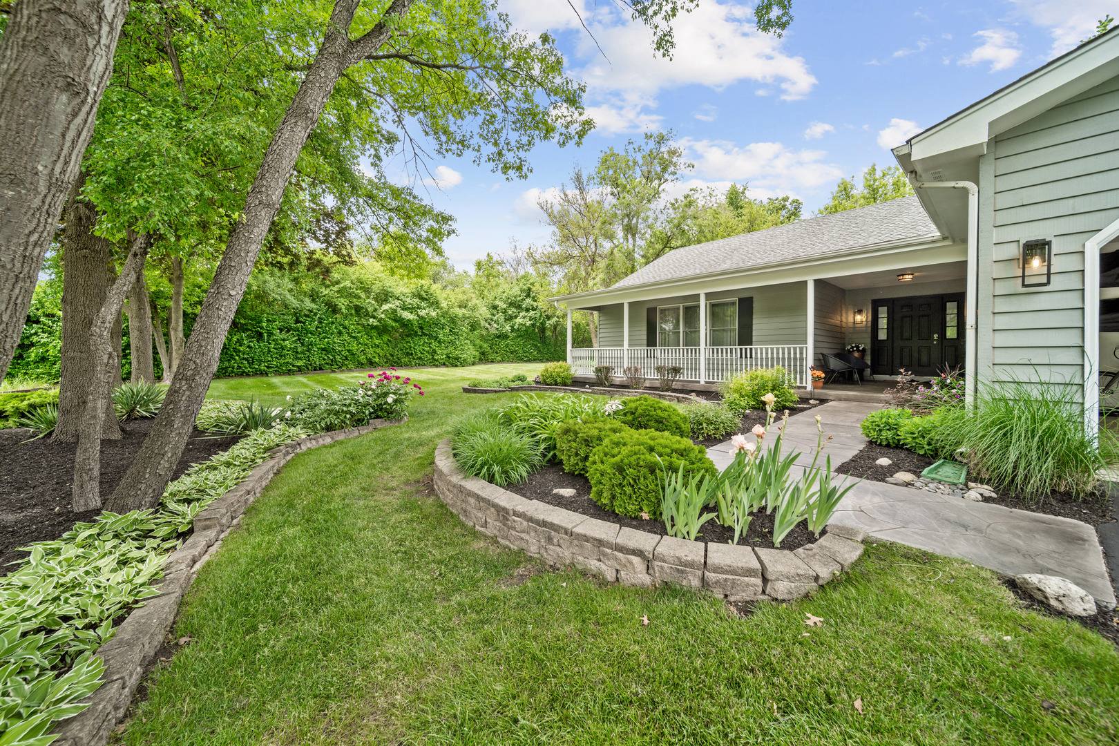 28W140 Mack Road Wheaton, IL 60189 - Photo 43 of 48 a view of a house with a yard and potted plants