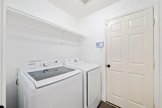a utility room with dryer and washer