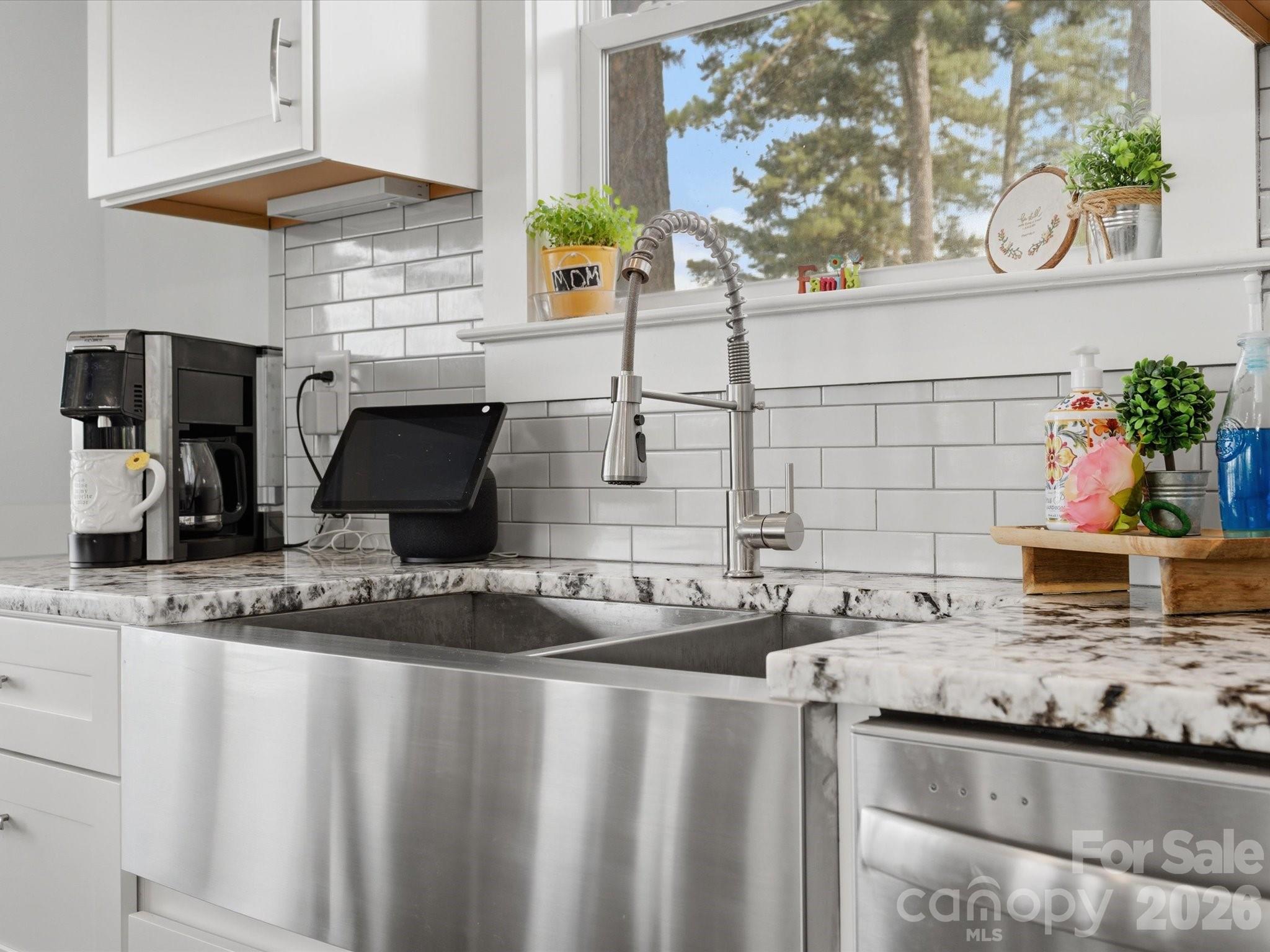 562 Lake Head Road Norwood, NC 28128 - Photo 21 of 43 a kitchen with granite countertop a sink and a stove