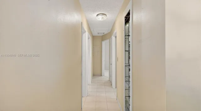 a living room with a piano and a table