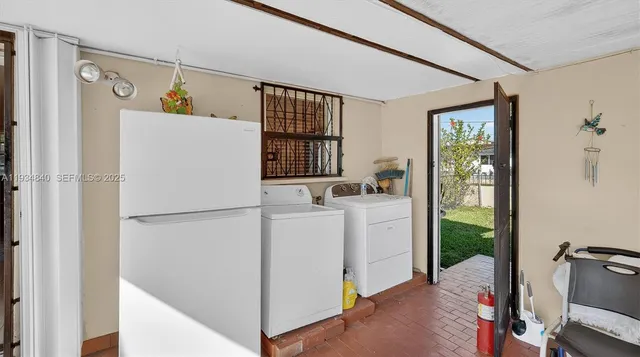 a view of a entryway with furniture and floor to ceiling window