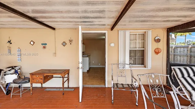 a view of a dining room with furniture wooden floor and a chandelier