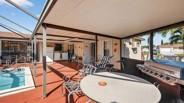 a view of a swimming pool with a patio