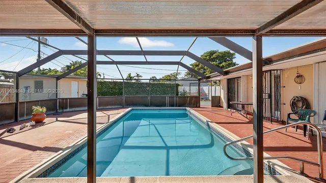 a view of a swimming pool with a patio
