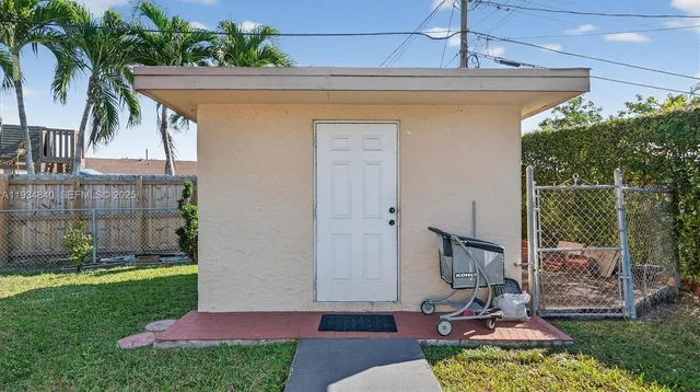 an aerial view of a houses with a garden