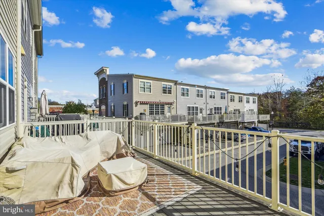 a view of a balcony with wooden floor