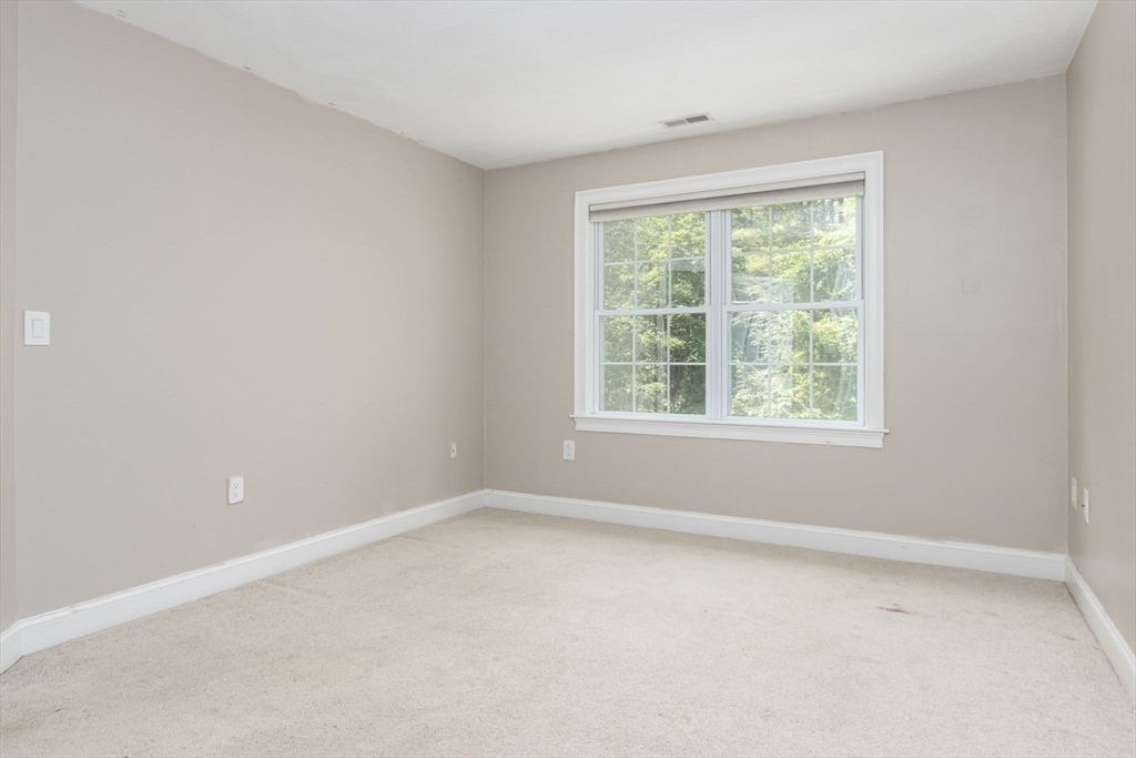 3 Integrity Way Groton, MA 01450 - Photo 31 of 42 an empty room with a window