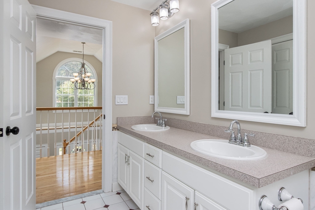 3 Integrity Way Groton, MA 01450 - Photo 33 of 42 a en suite bathroom with a sink a mirror and a shower