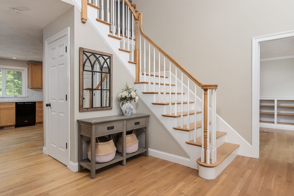 3 Integrity Way Groton, MA 01450 - Photo 4 of 42 a view of entryway with wooden floor and stairs