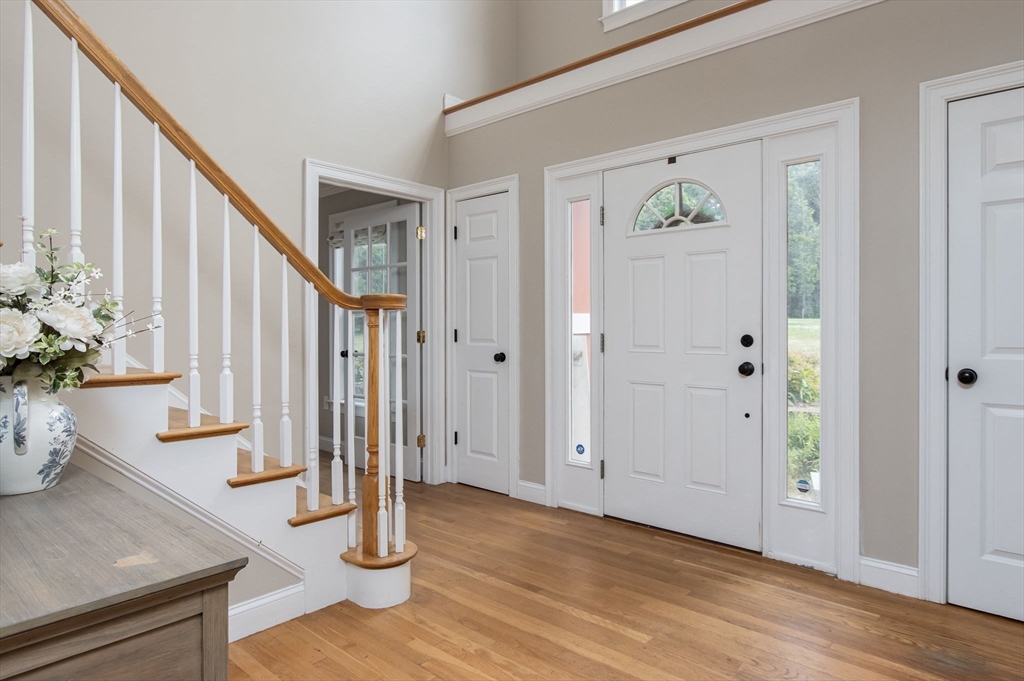 3 Integrity Way Groton, MA 01450 - Photo 5 of 42 a view of an entryway with wooden floor and door
