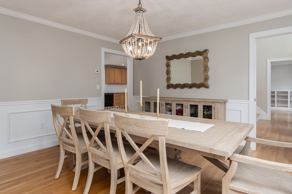 3 Integrity Way Groton, MA 01450 - Photo 7 of 42 a view of a dining room with furniture and chandelier