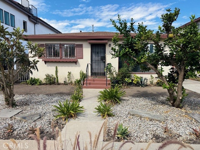 2323 Carmona Avenue Los Angeles, CA 90016 - Photo 3 of 5 a front view of a house with garden