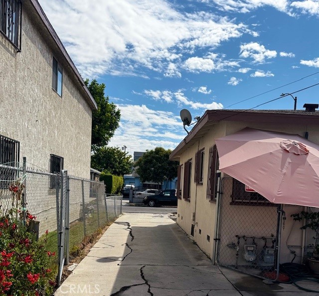 2323 Carmona Avenue Los Angeles, CA 90016 - Photo 4 of 5 a view of a street with cars on city street