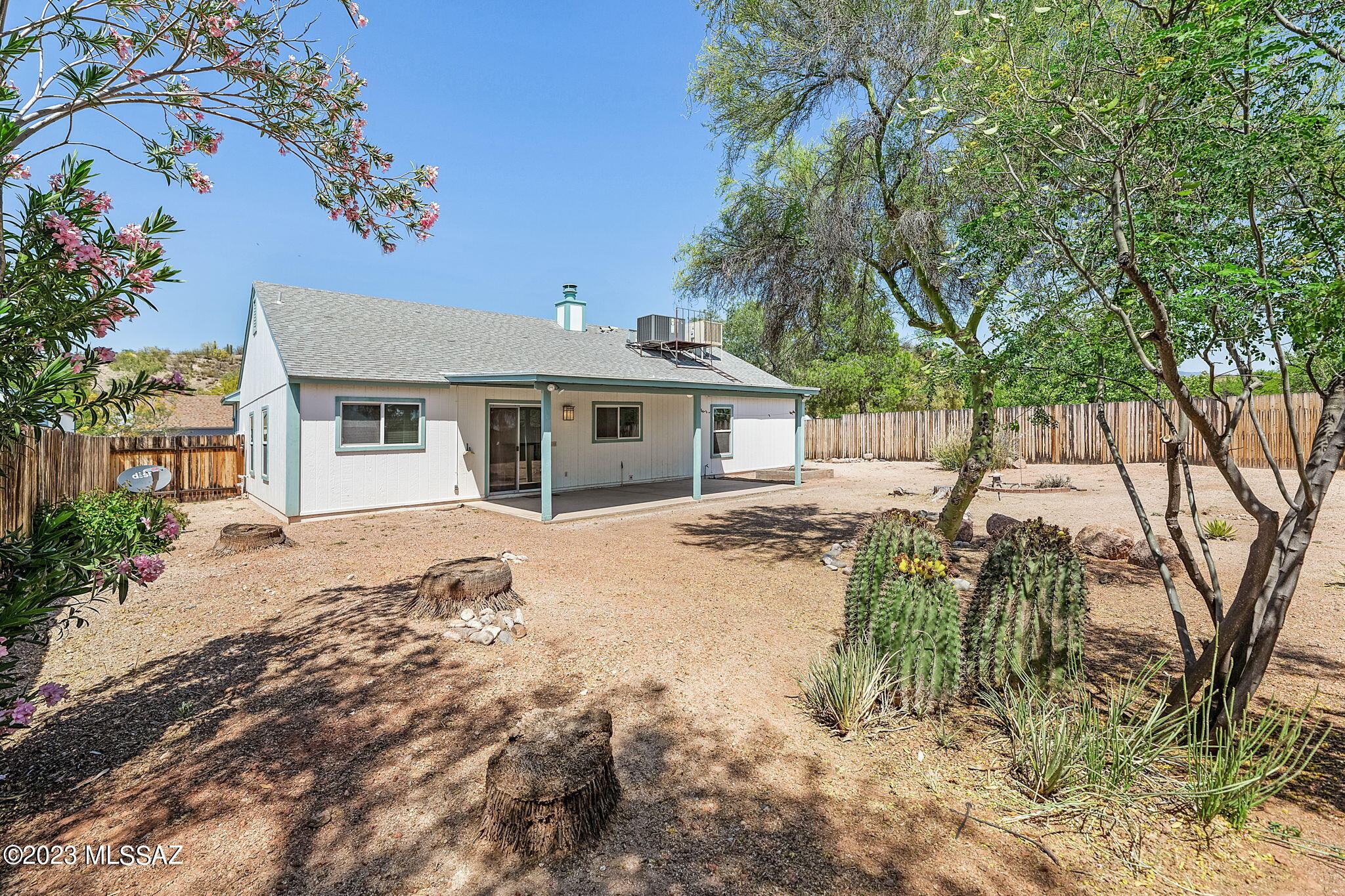 10610 Keystone Road East Tucson, AZ 85730 - Photo 4 of 35 a front view of a house with a garden