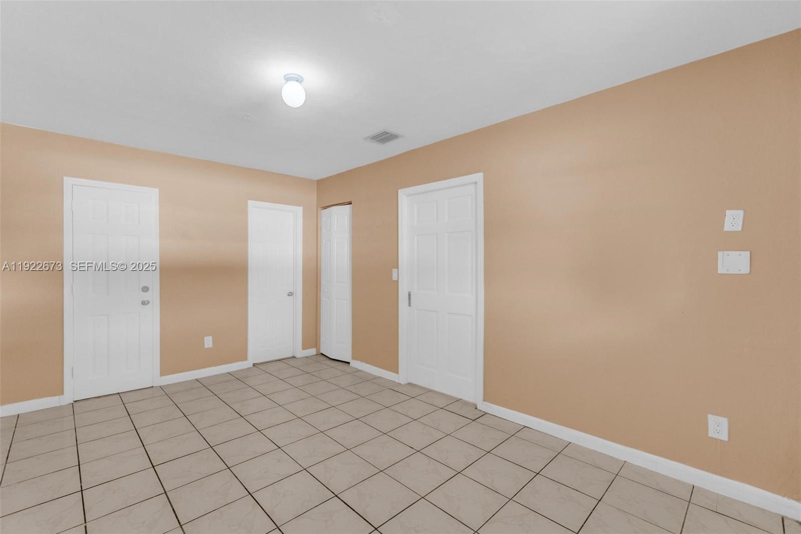 10220 Southwest 178th Street, Unit 10220 Miami, FL 33157 - Photo 17 of 25 a view of an empty room