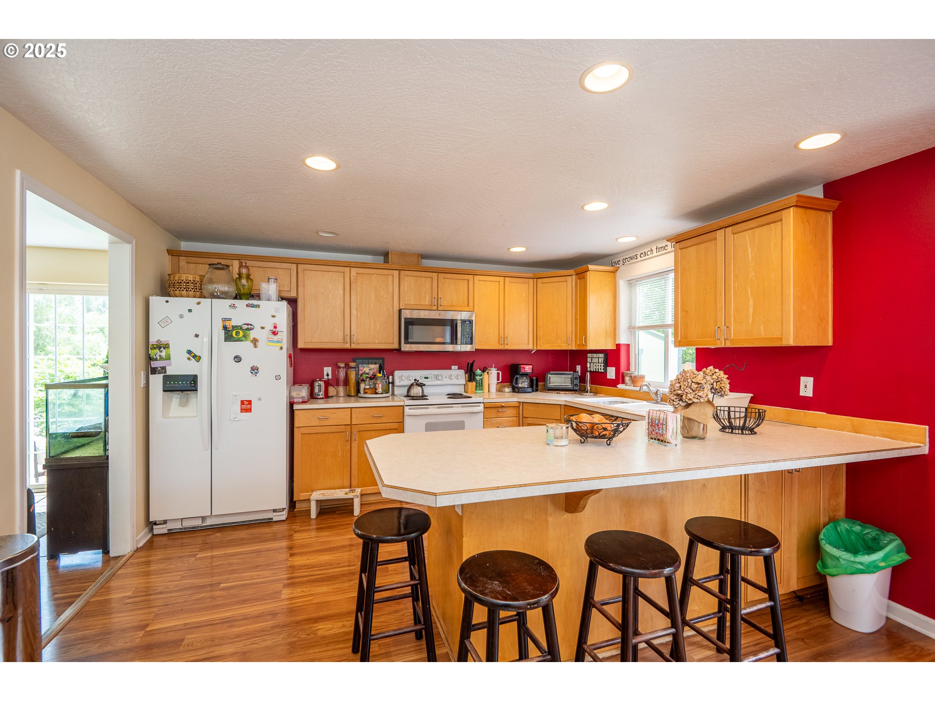 4217 Cole Way Springfield, OR 97478 - Photo 11 of 43 a dining hall with stainless steel appliances granite countertop a dining table chairs and a refrigerator