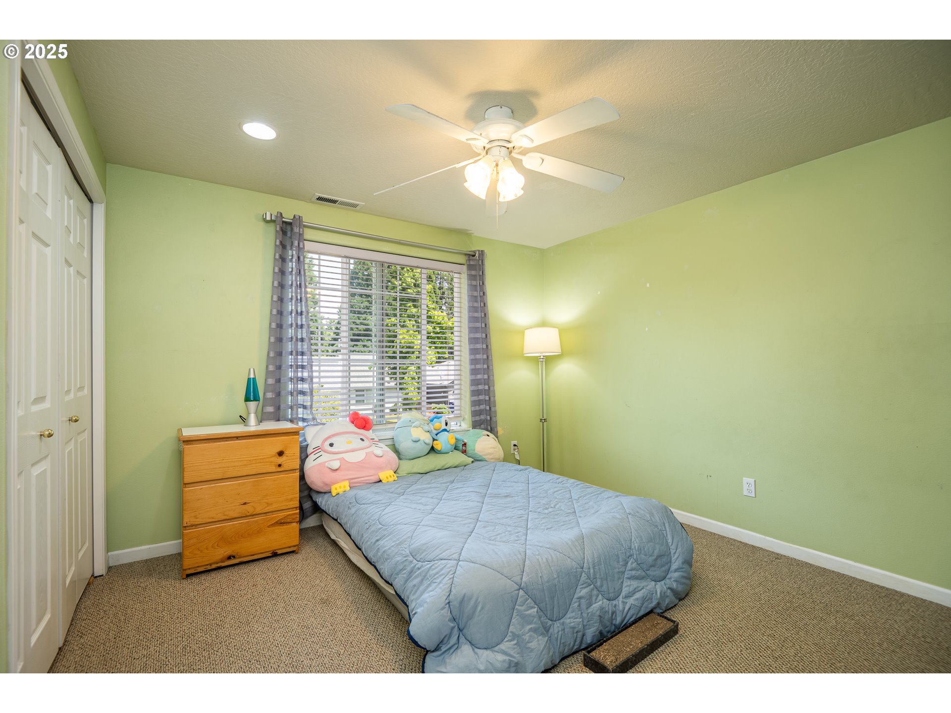 4217 Cole Way Springfield, OR 97478 - Photo 22 of 43 a bedroom with a bed and a chandelier
