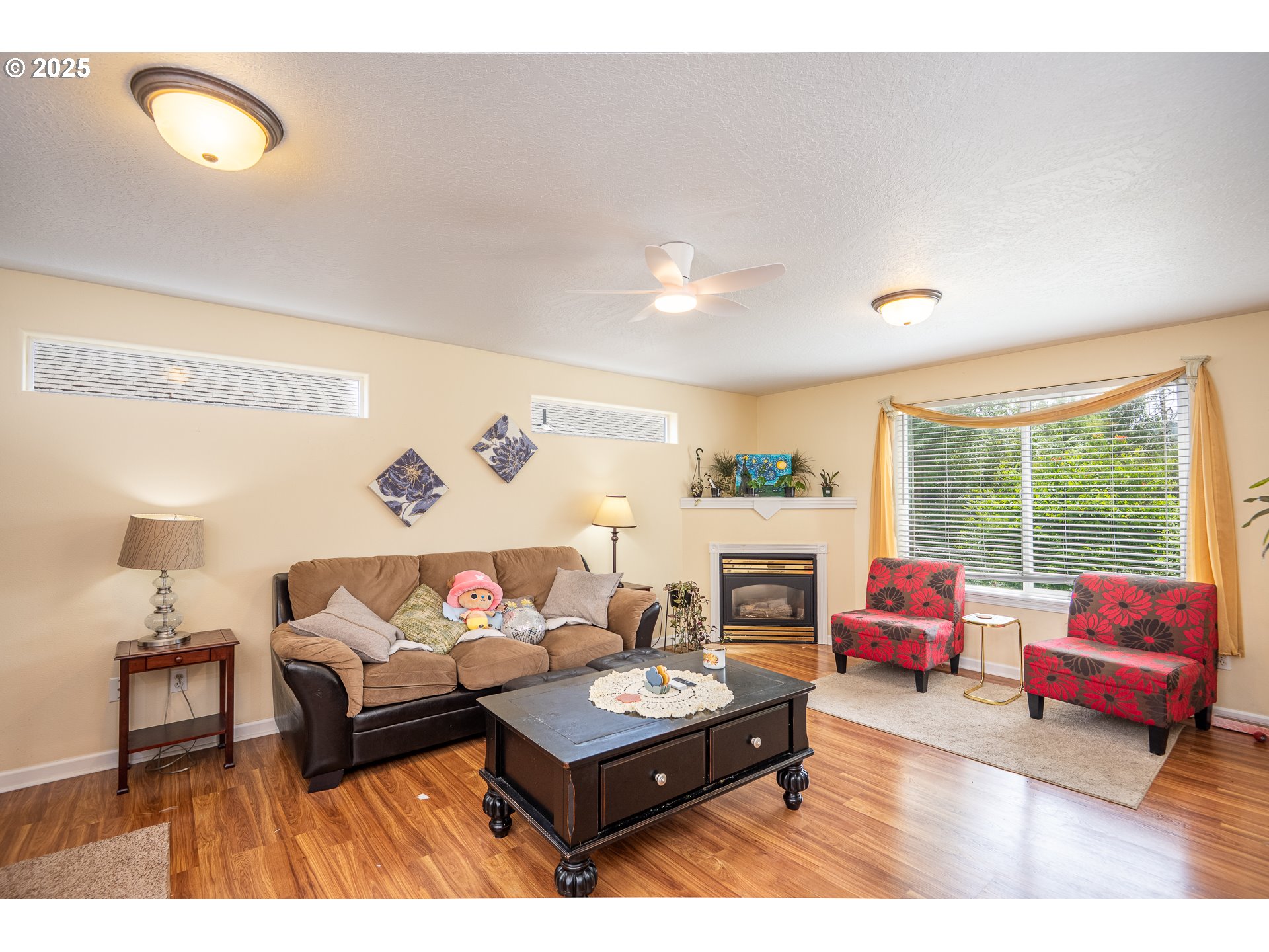 4217 Cole Way Springfield, OR 97478 - Photo 6 of 43 a living room with furniture fireplace and a large window