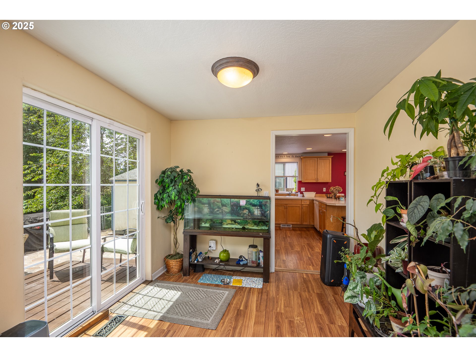 4217 Cole Way Springfield, OR 97478 - Photo 9 of 43 a view of a living room and a floor to ceiling window or wooden floor