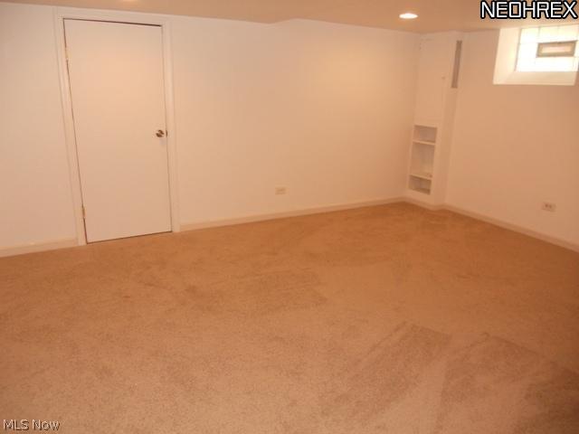 1260 Homestead Road South Euclid, OH 44121 - Photo 12 of 13 Large finished Lower Lever with recreation room, 1/2 bath, storage and newer carpeting & glass Block winder