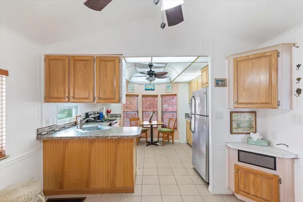 a kitchen with a sink and a refrigerator