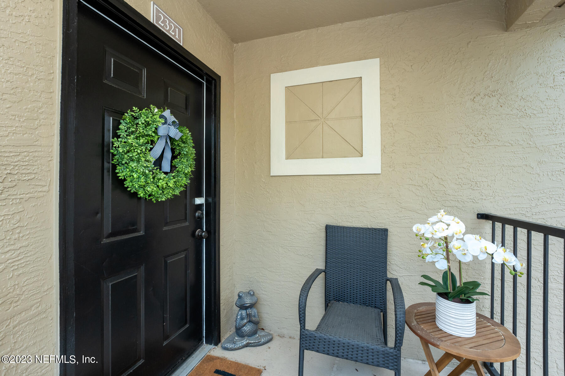 a dining room with furniture and a potted plants