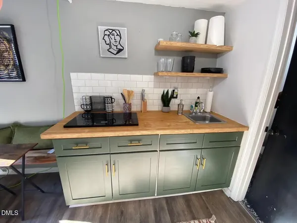 a kitchen with a stove and cabinets