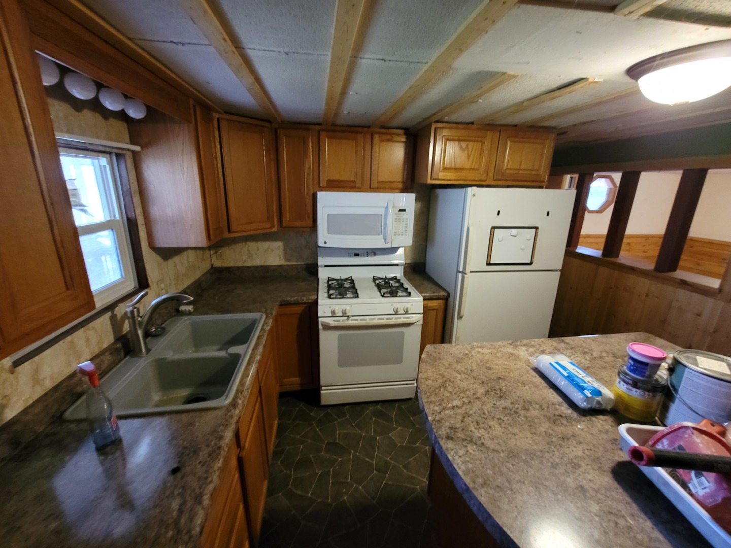 141 Spring Road Dixon, IL 61021 - Photo 4 of 14 a kitchen with a sink appliances and cabinets