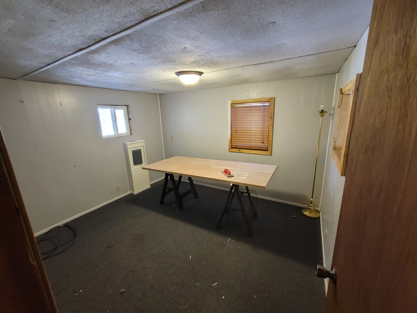 141 Spring Road Dixon, IL 61021 - Photo 8 of 14 an empty room with windows and furniture