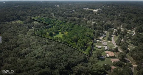 an aerial view of residential house with outdoor space