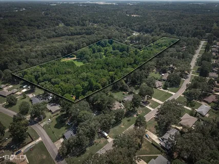 an aerial view of residential house with parking space