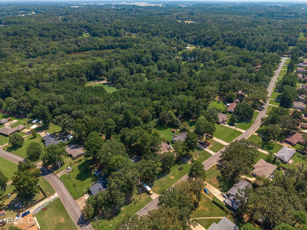 5844 Jefferson Paige Road Shreveport, LA 71119 - Photo 8 of 16 an aerial view of a house with a yard