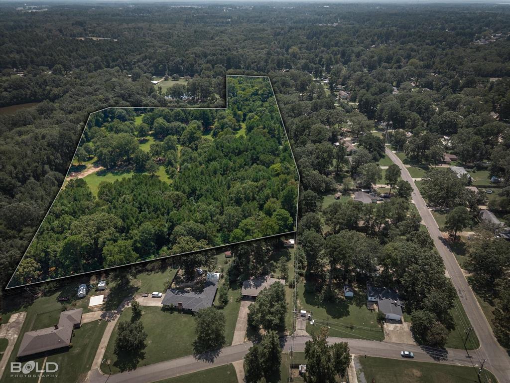 5844 Jefferson Paige Road Shreveport, LA 71119 - Photo 9 of 16 an aerial view of residential houses with outdoor space