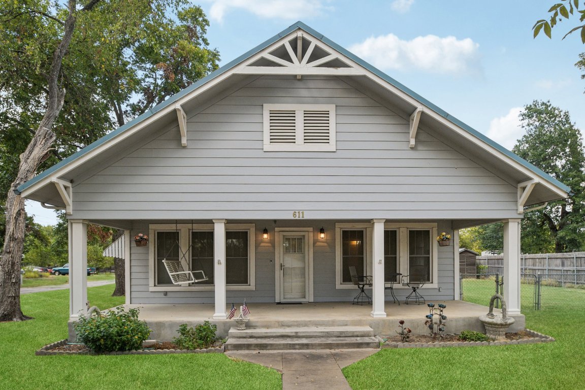 611 North Main Street Elgin, TX 78621 - Photo 1 of 34 Virtual staged green grass and a corner lot.