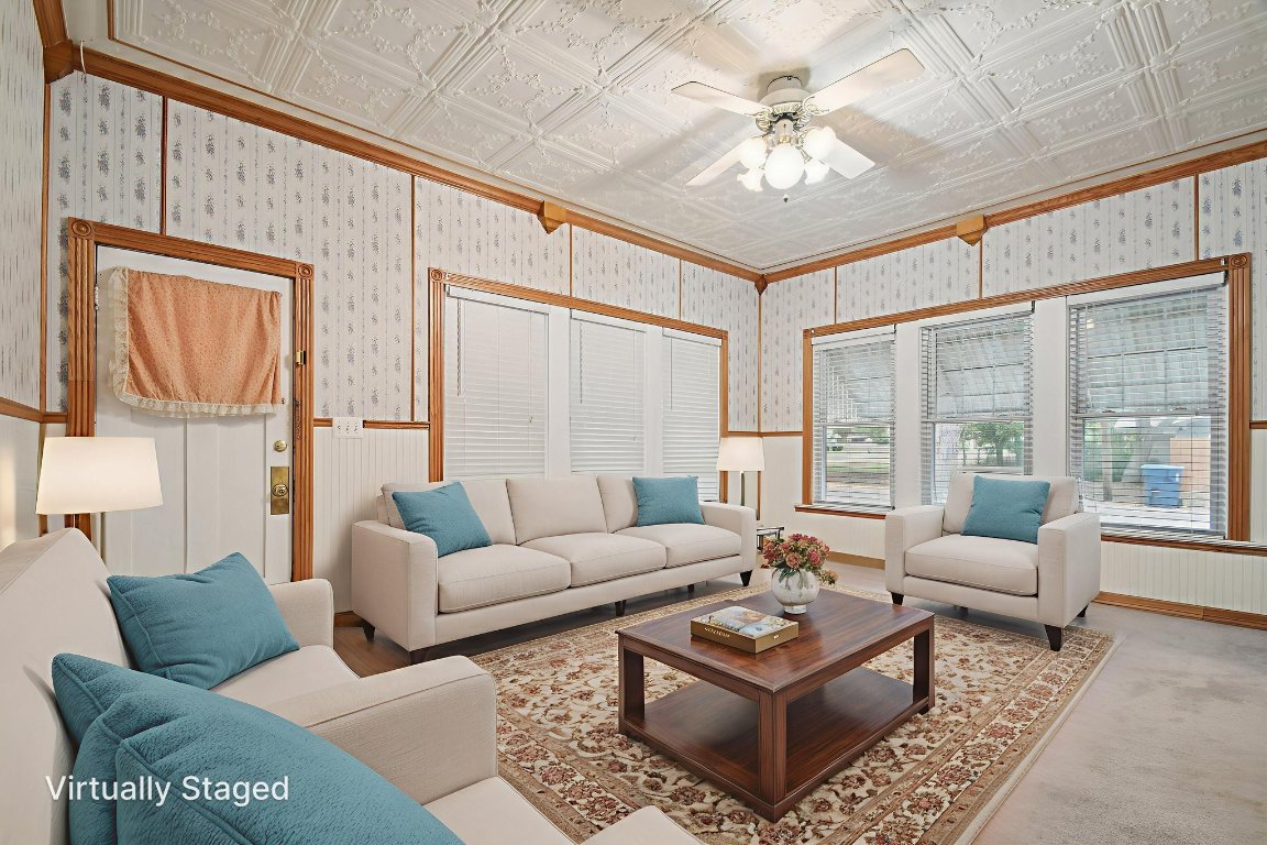 611 North Main Street Elgin, TX 78621 - Photo 9 of 34 Virtually staged living room with pressed metal ceililngs thoughout