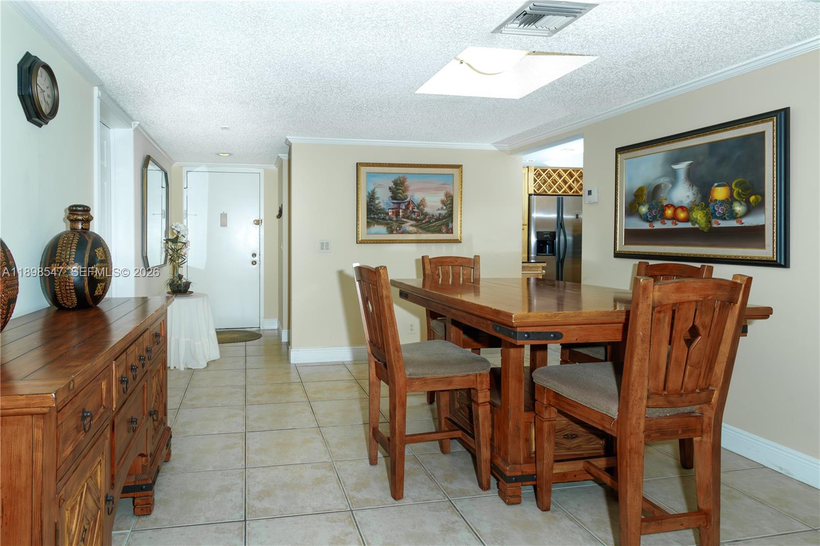 16200 Golf Club Road, Unit 312 Weston, FL 33326 - Photo 5 of 31 a dining room with furniture and window