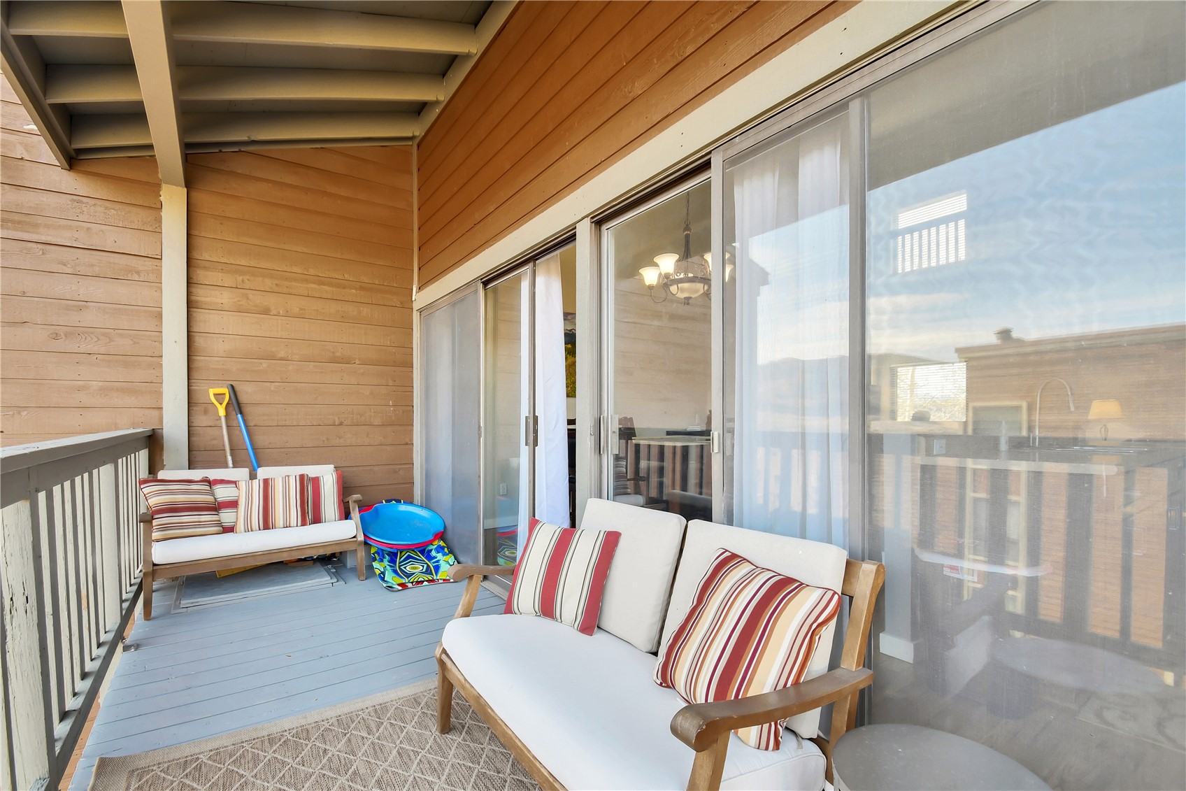 2710 Ryan Gulch Road, Unit 2731 Silverthorne, CO 80498 - Photo 14 of 39 a balcony with furniture and a potted plant