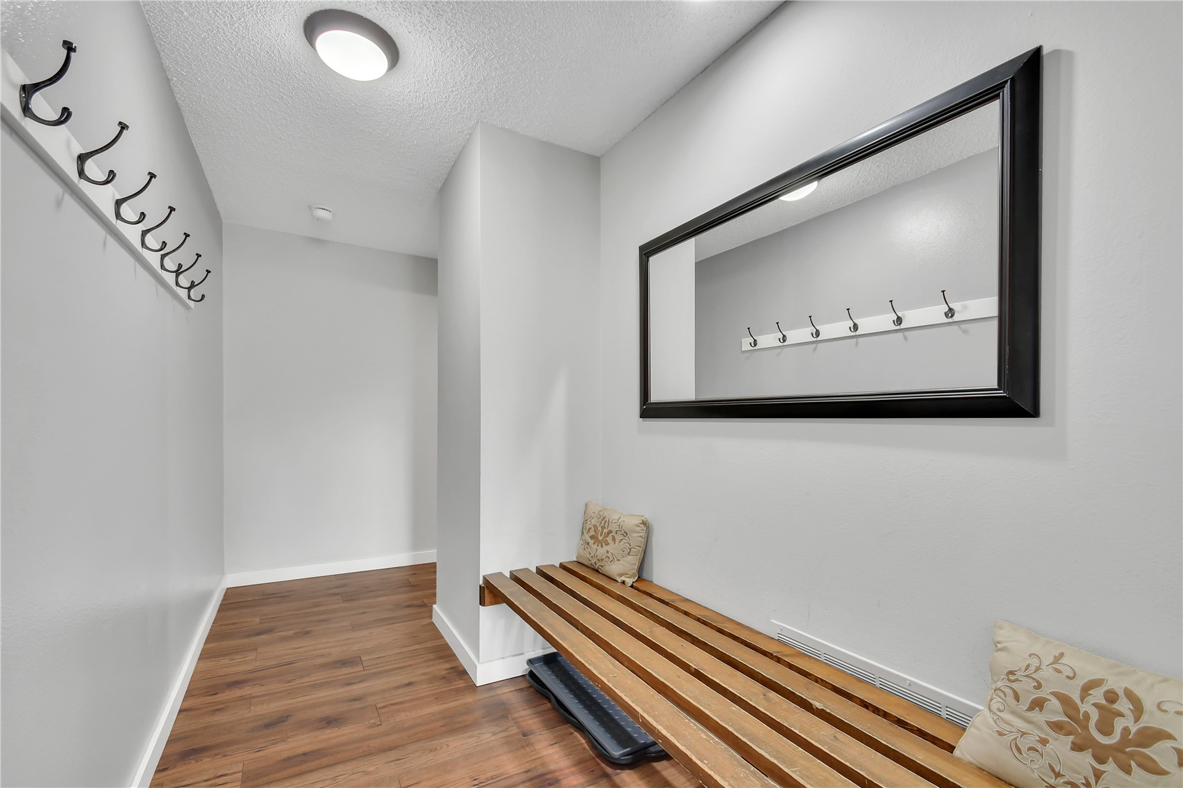 2710 Ryan Gulch Road, Unit 2731 Silverthorne, CO 80498 - Photo 16 of 39 a view of a hallway with bed and a chandelier
