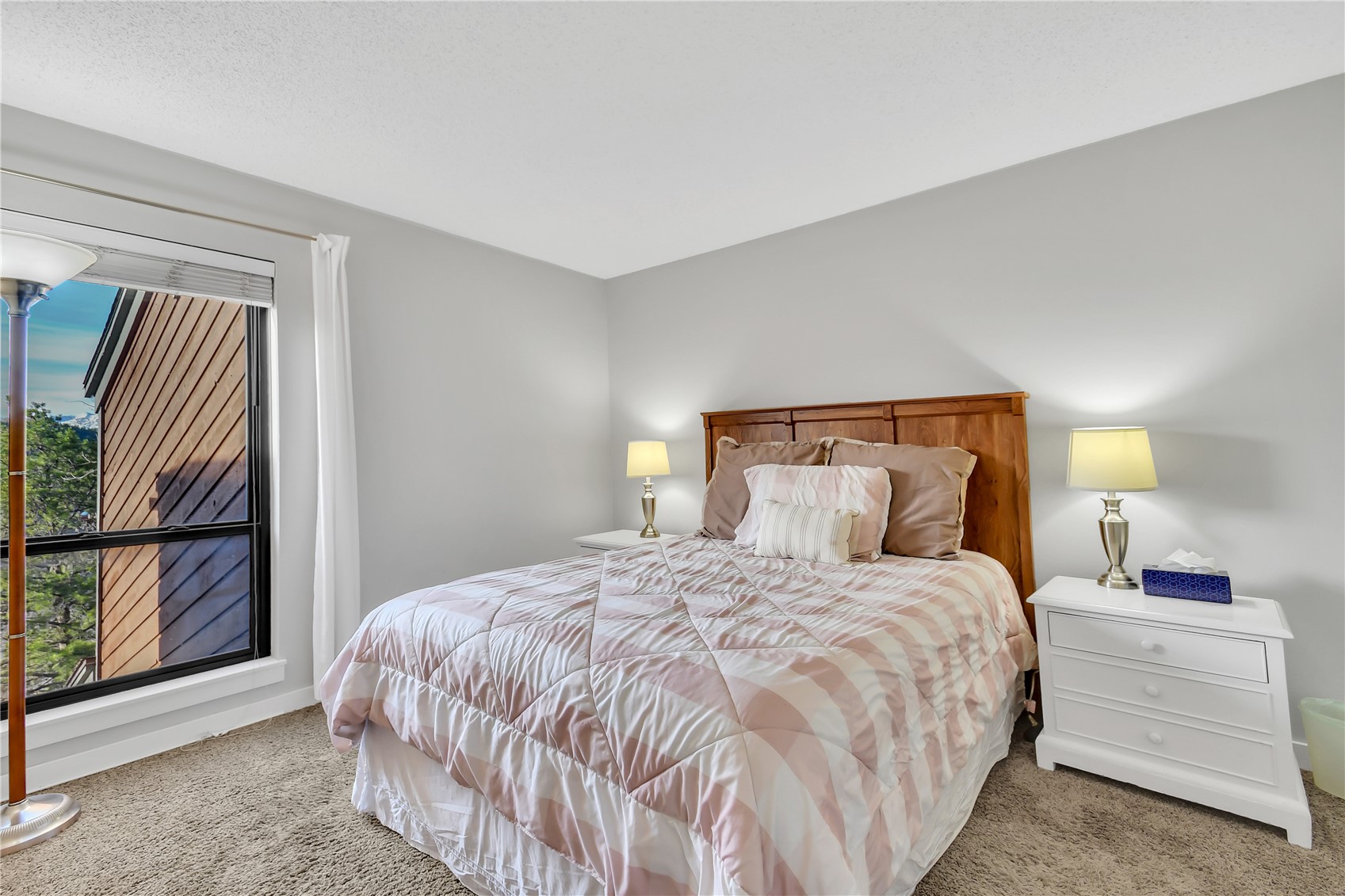 2710 Ryan Gulch Road, Unit 2731 Silverthorne, CO 80498 - Photo 17 of 39 a bedroom with a large bed and a window