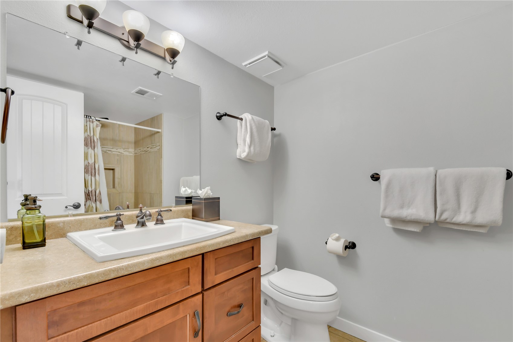 2710 Ryan Gulch Road, Unit 2731 Silverthorne, CO 80498 - Photo 19 of 39 a bathroom with a sink toilet and mirror