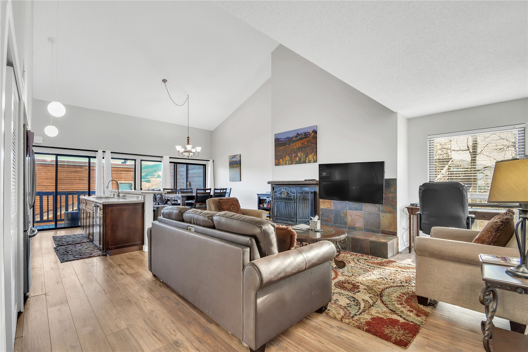 2710 Ryan Gulch Road, Unit 2731 Silverthorne, CO 80498 - Photo 2 of 39 a living room with furniture and a flat screen tv