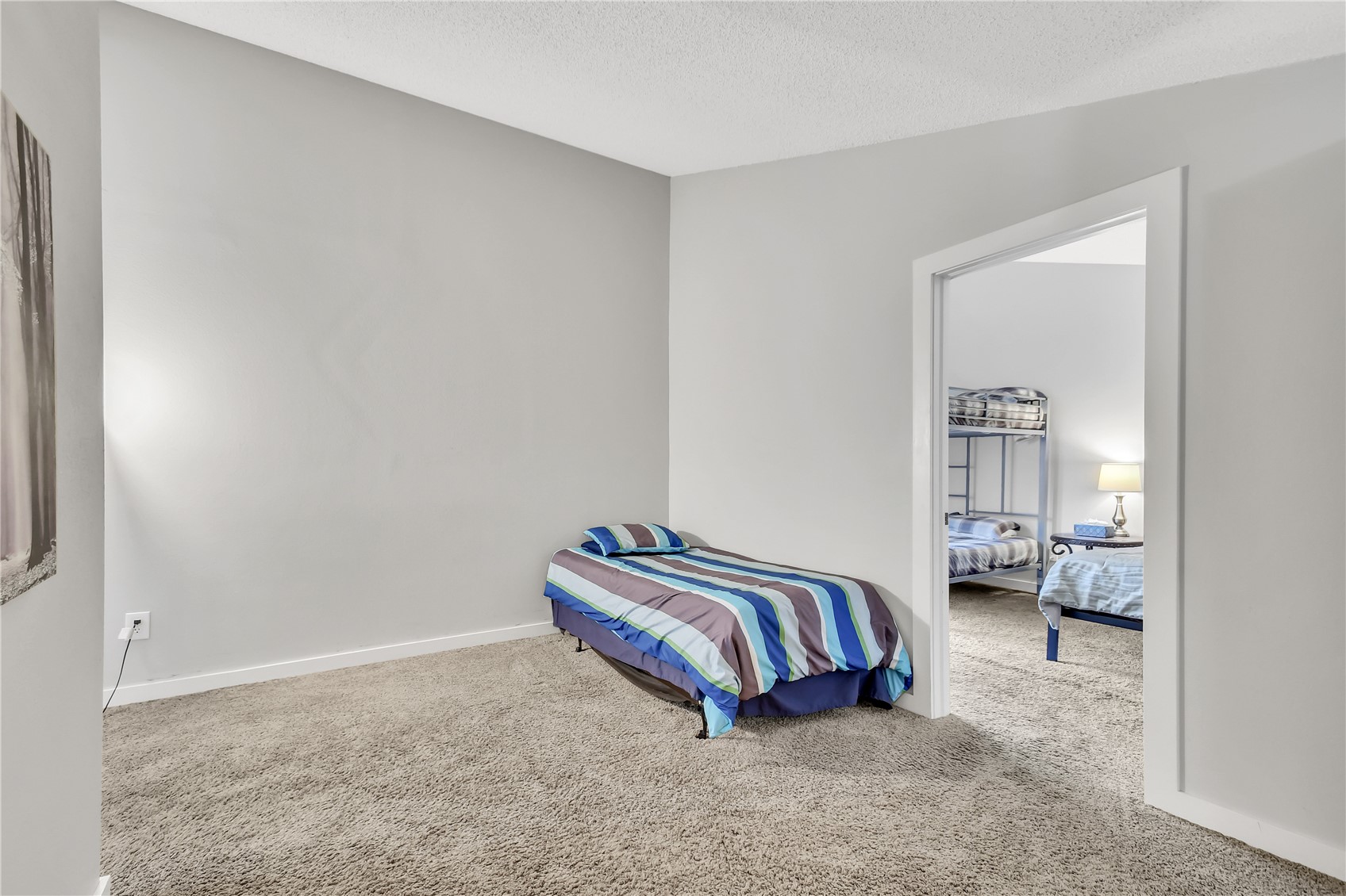 2710 Ryan Gulch Road, Unit 2731 Silverthorne, CO 80498 - Photo 25 of 39 a spacious bedroom with a bed and window