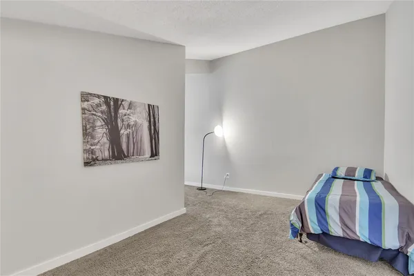 a view of room with stairs and closet
