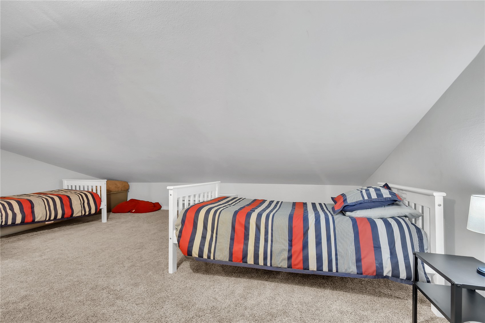 2710 Ryan Gulch Road, Unit 2731 Silverthorne, CO 80498 - Photo 33 of 39 a room with a bed and a couch