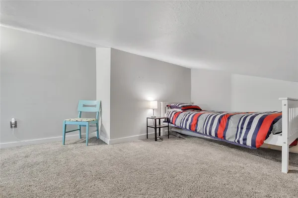 a living room with a couch and a chair