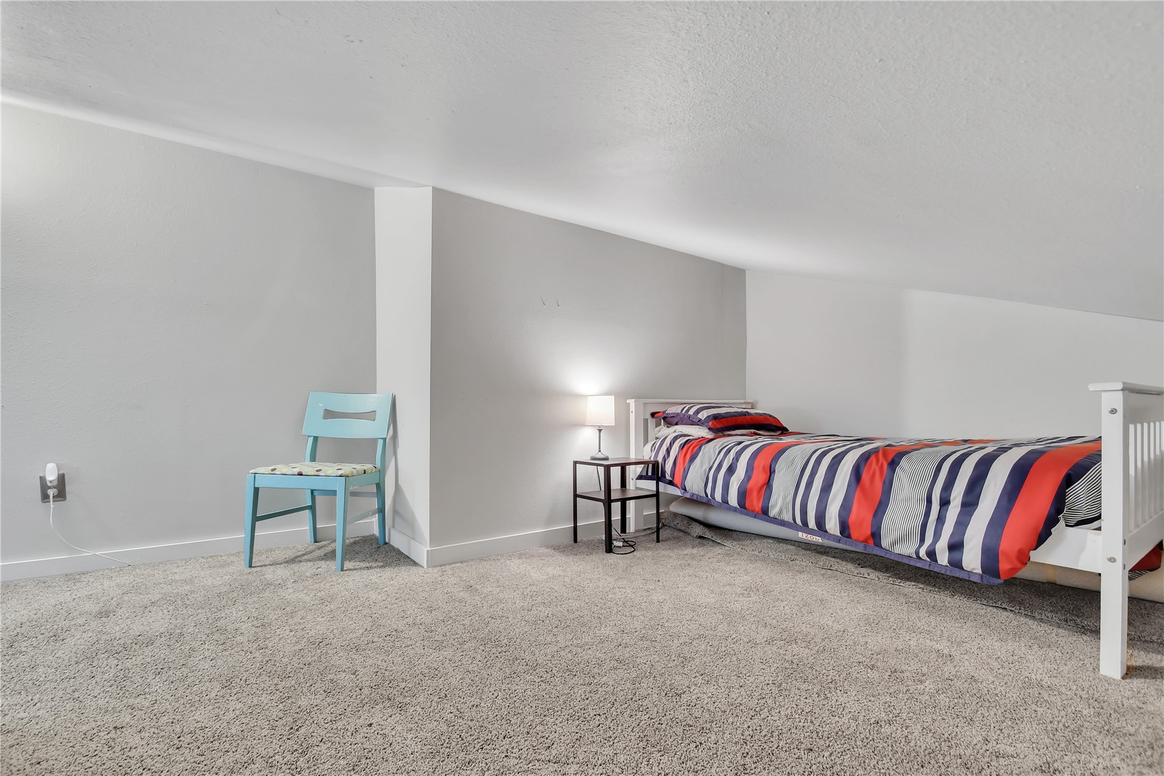 2710 Ryan Gulch Road, Unit 2731 Silverthorne, CO 80498 - Photo 34 of 39 a living room with a couch and a chair