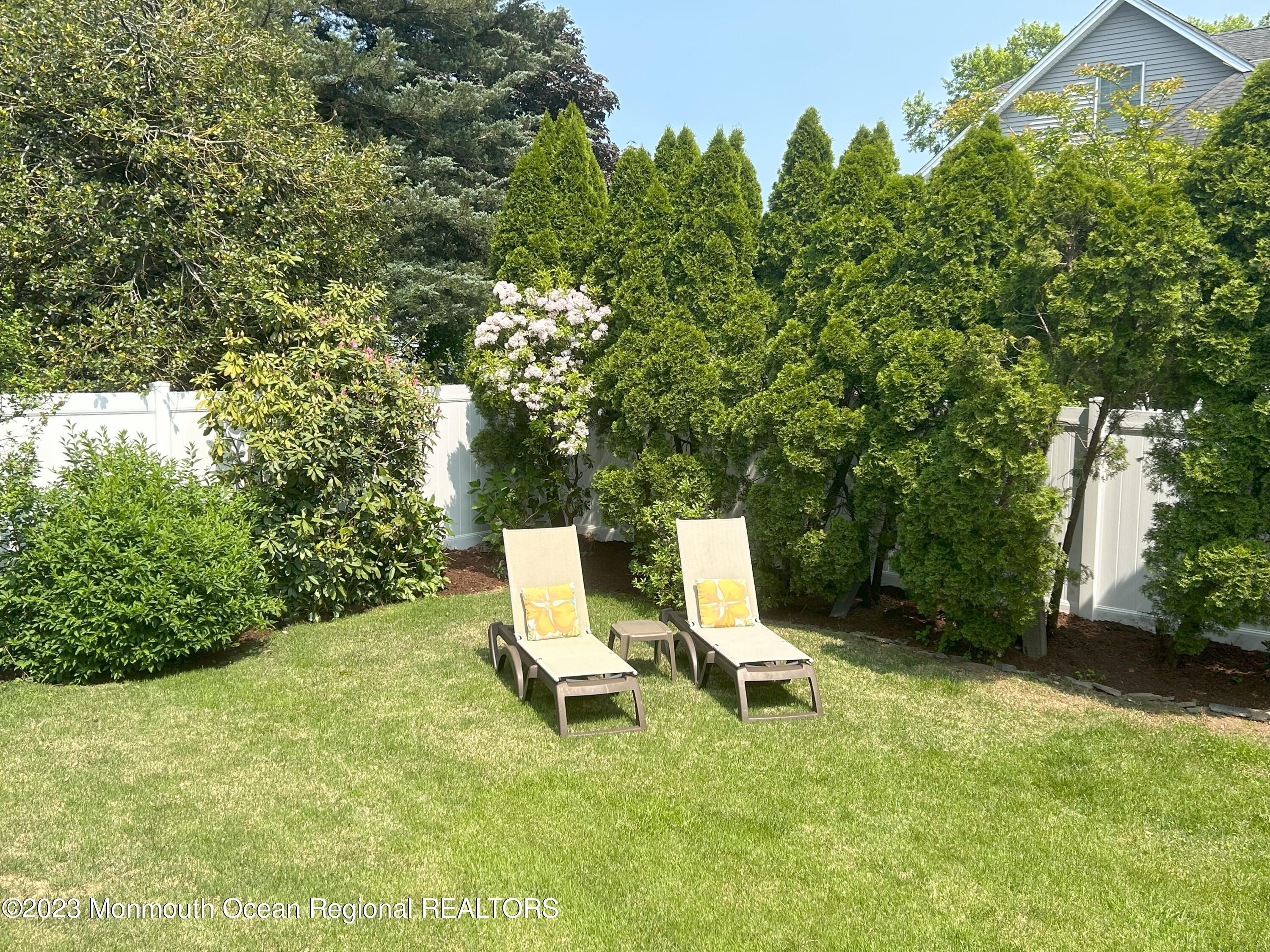 608 Brielle Avenue Brielle, NJ 08730 - Photo 13 of 56 a view of backyard with a table and a chairs