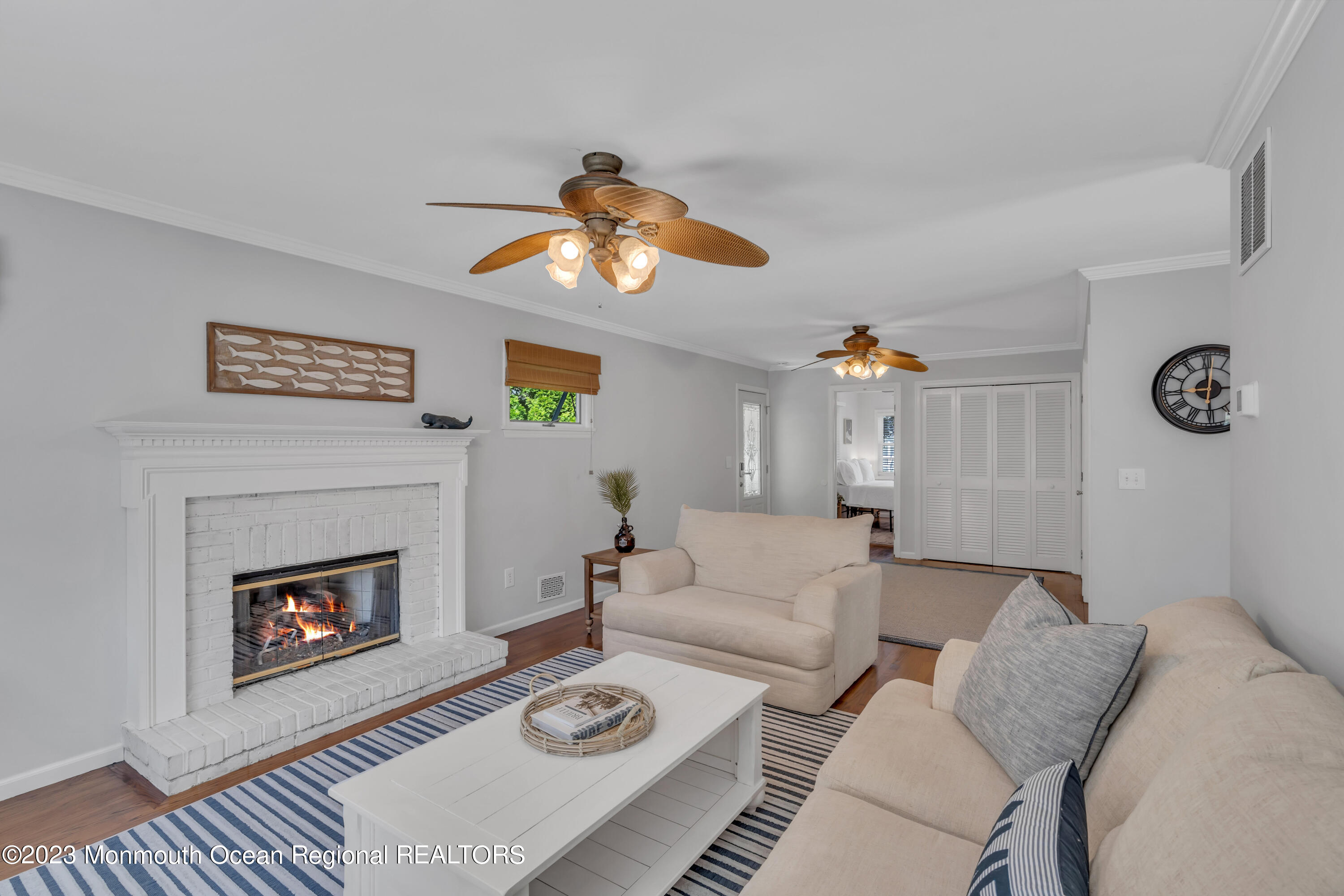 608 Brielle Avenue Brielle, NJ 08730 - Photo 17 of 56 a living room with furniture a rug and a fireplace