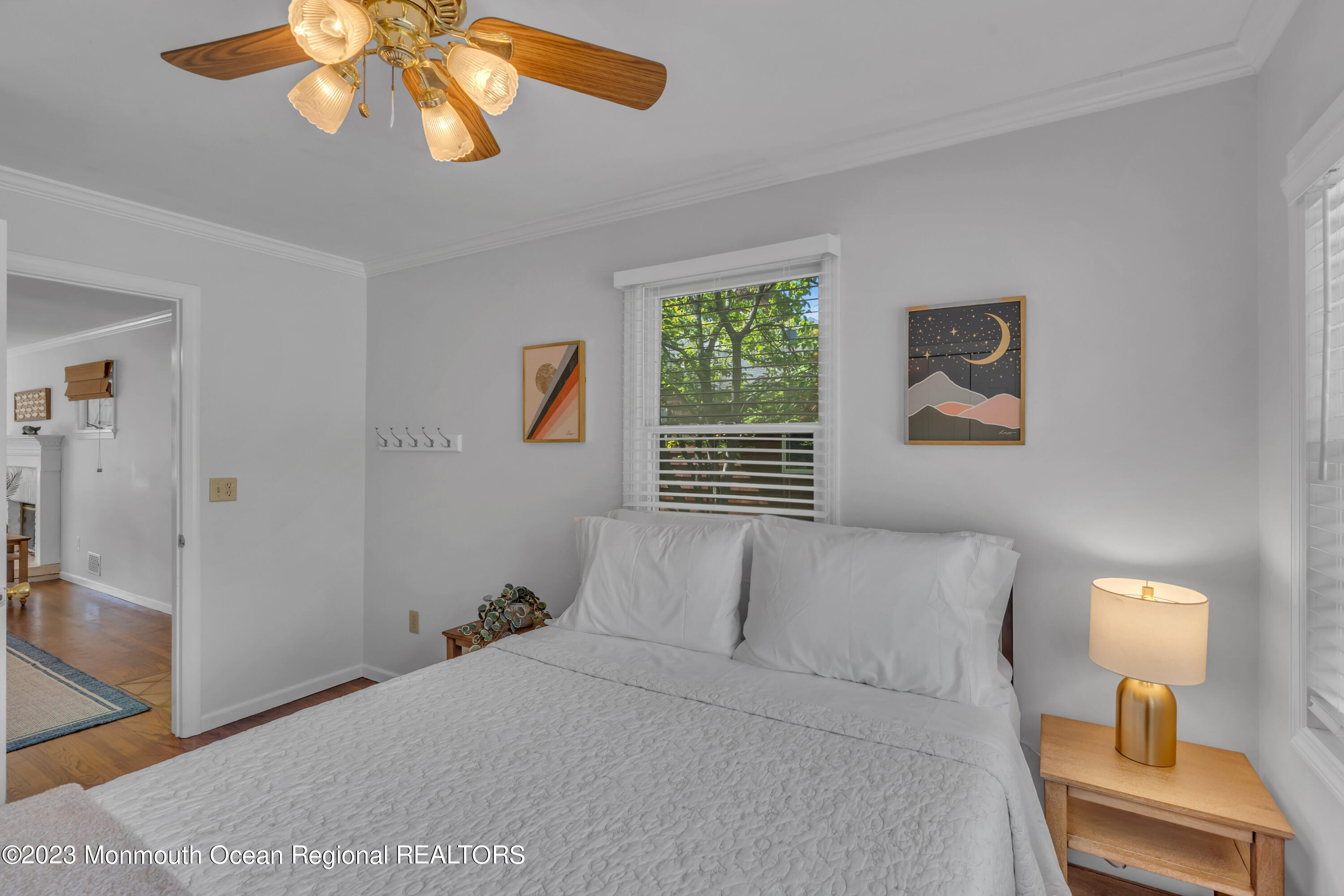 608 Brielle Avenue Brielle, NJ 08730 - Photo 20 of 56 a bedroom with a bed and a chandelier