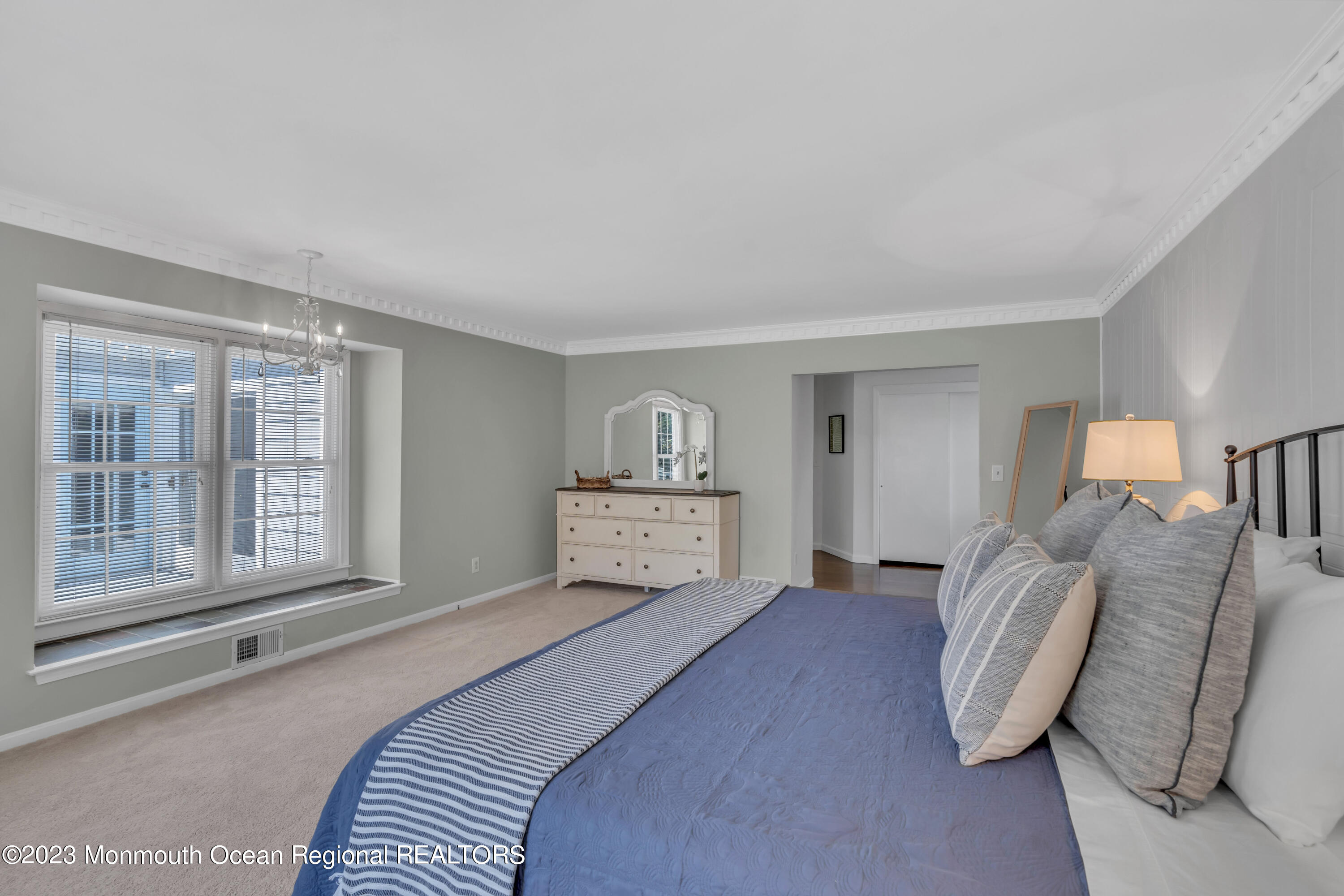 608 Brielle Avenue Brielle, NJ 08730 - Photo 29 of 56 a bedroom with a large bed and a large window